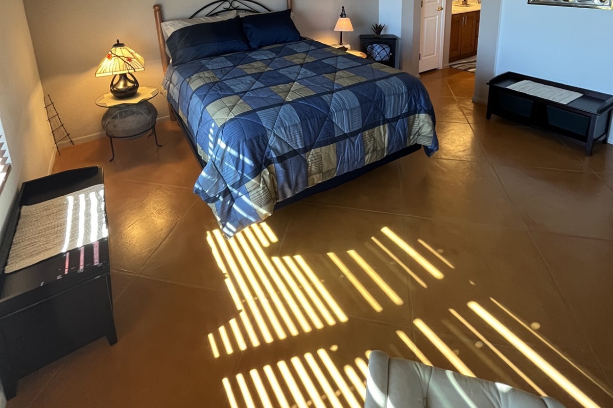 Primary suite bedroom offers a queen bed