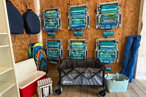 6 Tommy Bahama beach chairs, 2 umbrellas, coolers, a beach wagon and a beach bag