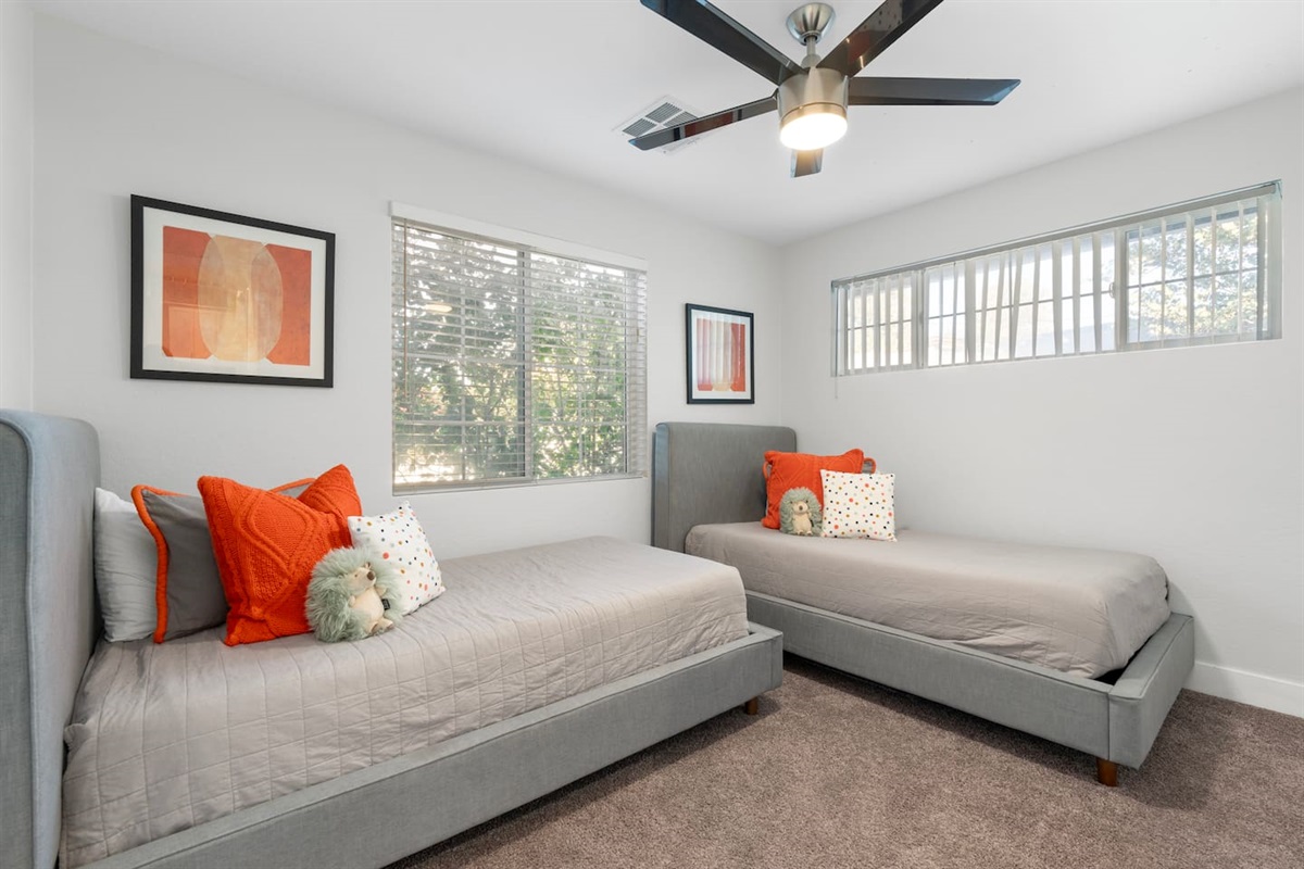 Bedroom featuring two single beds, offering flexible sleeping arrangements and a spacious feel.