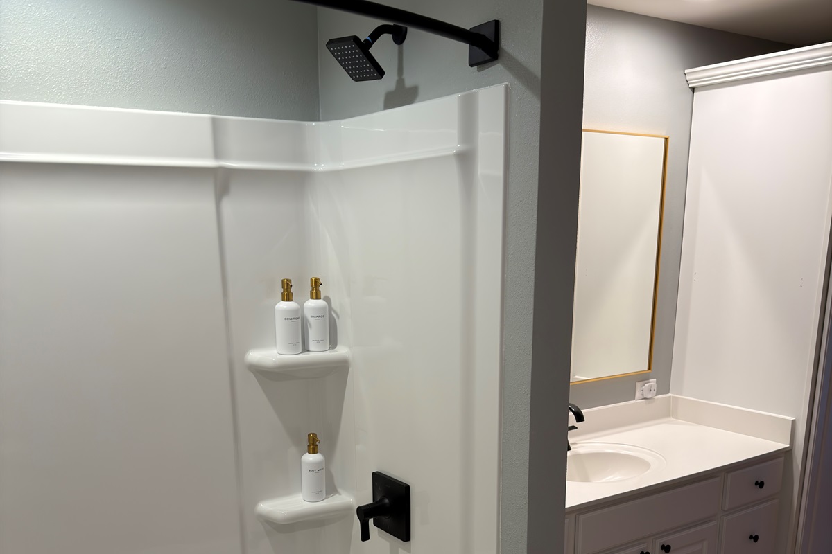 Brand new tub and surround with Kohler faucet and shower head.