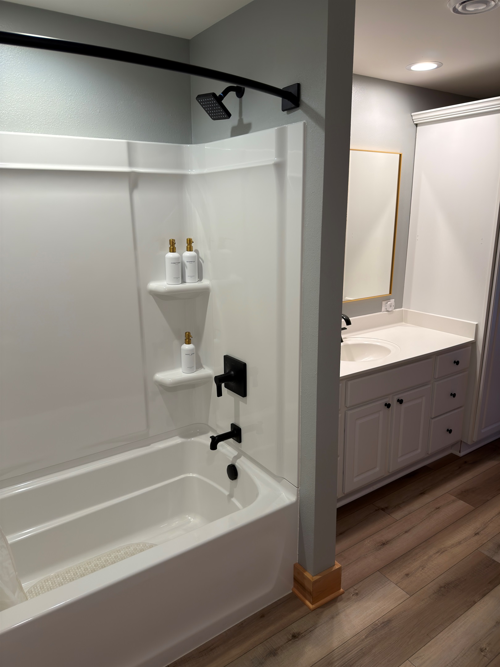 Brand new tub and surround with Kohler faucet and shower head.