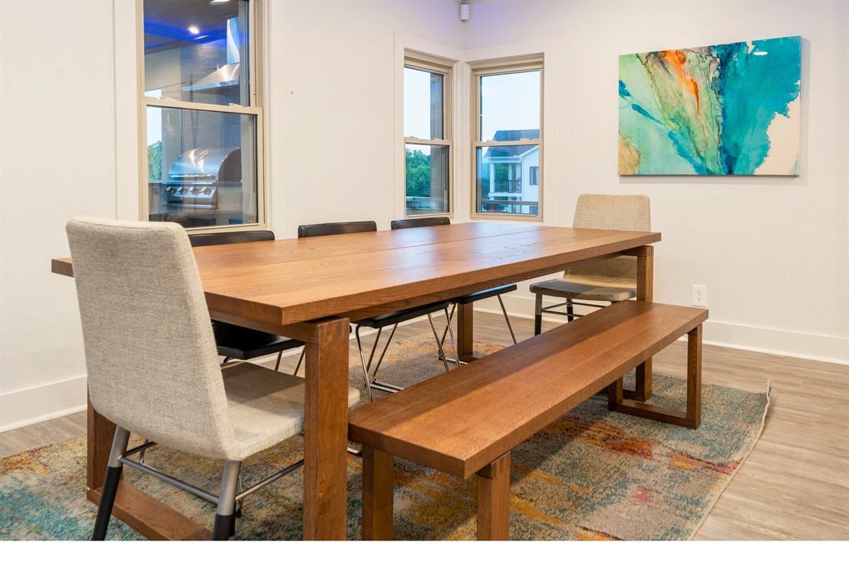 The Indoor Dining Table has Seating for 8. There is Plenty of Extra Seating in the Outdoor Bar Area.