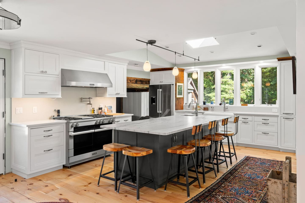 Kitchen with 60 inch professional gas range and 3 ovens