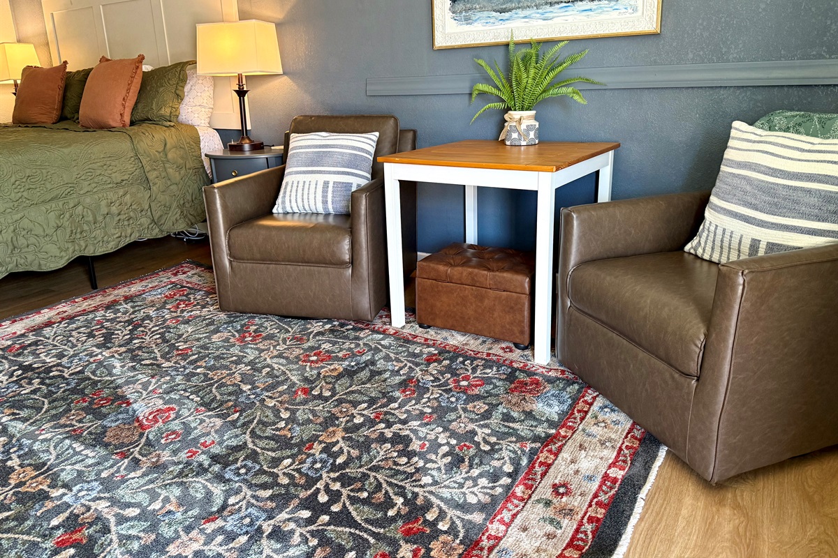 Seating area with ottoman.