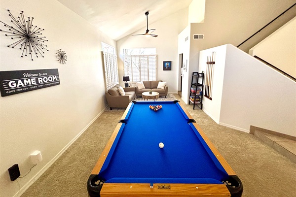 Game room with lounge area, pub seating, pool table, board games for the whole family