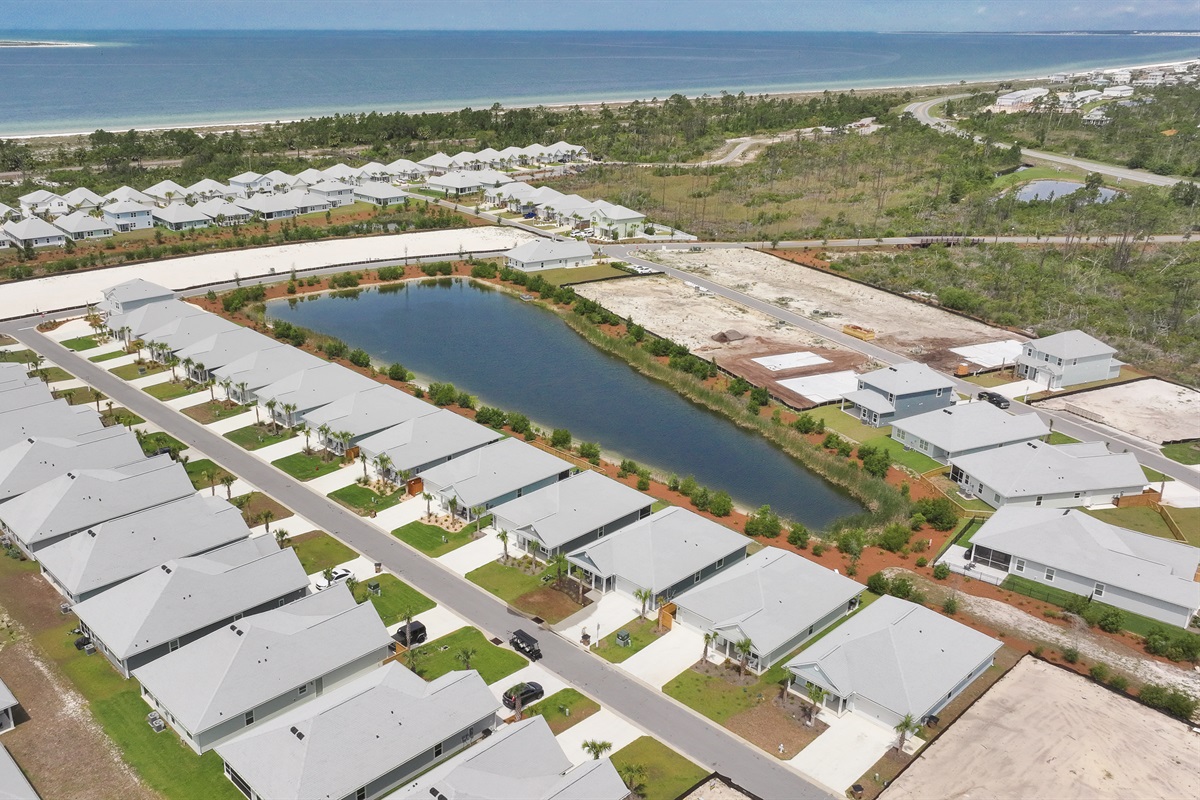 Scenic aerial shot of the home within few min golf cart distance to pool and beach areas