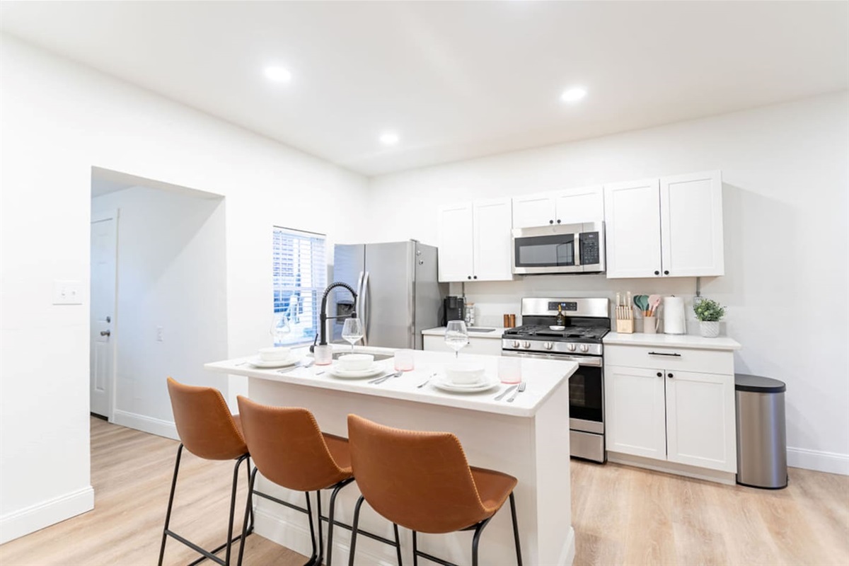 Chic kitchen dining countertop featuring a beautiful set of dishes, perfect for enjoying meals in style.
