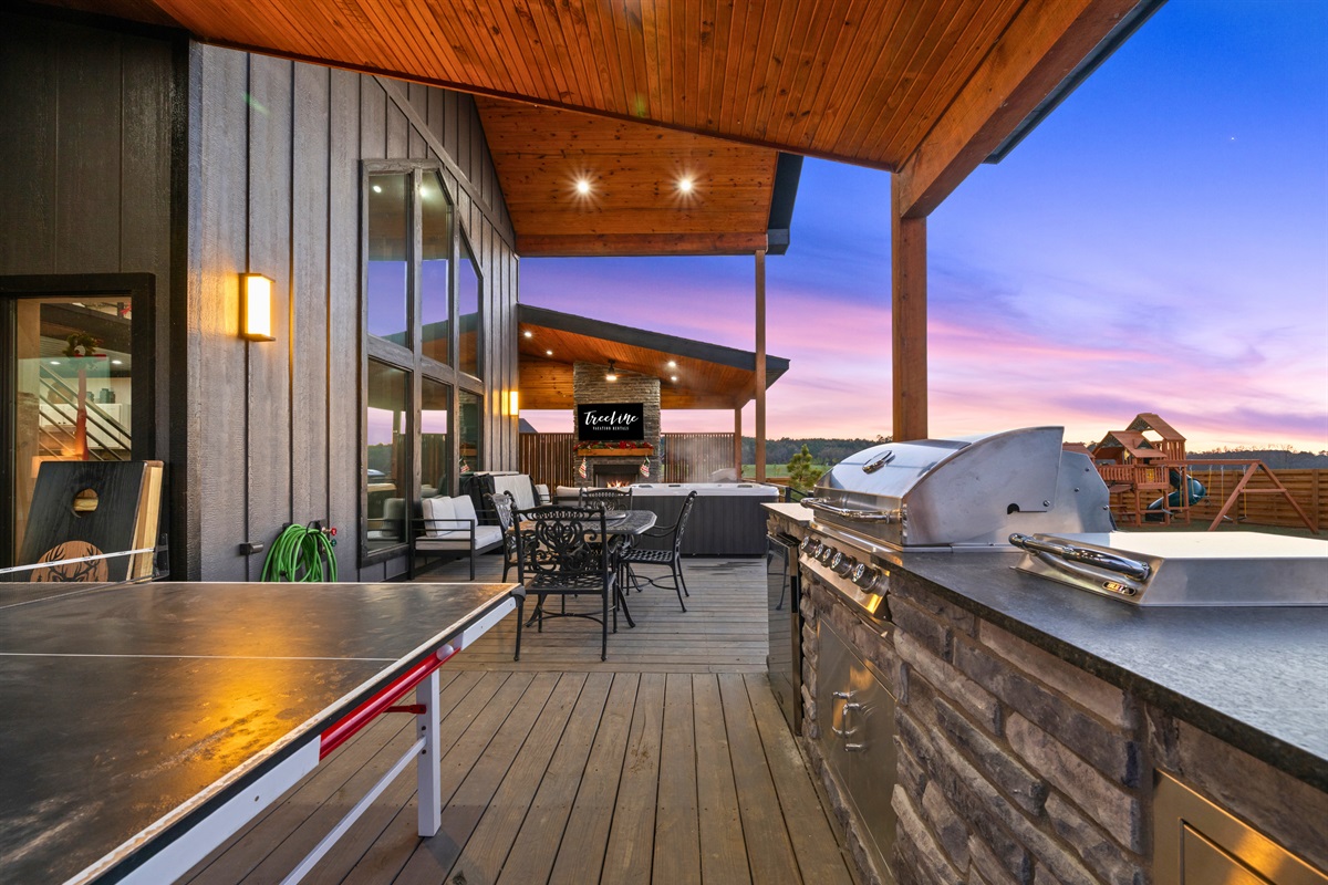 Another view of the outdoor kitchen shows just how spacious and well-equipped the grilling area really is.