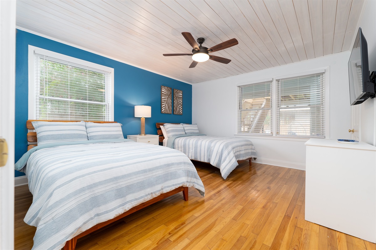 Relax and recharge in this light filled guest room with two cozy queen beds.  A great setup for kids or friends