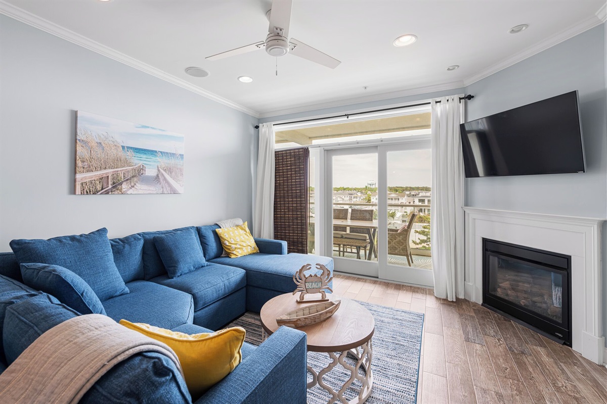 living room with fireplace and access to oversize balcony