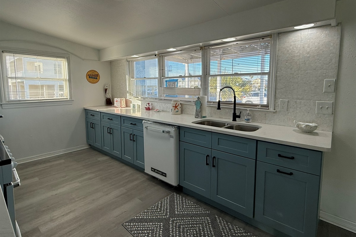 Blue Kitchen Cabinets with Retro Appliances and Mother of Pearl Backsplash!