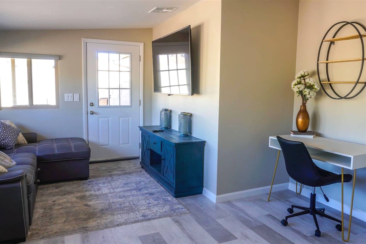 Relax and watch a show on the large tv or check a few emails at this great desk area.