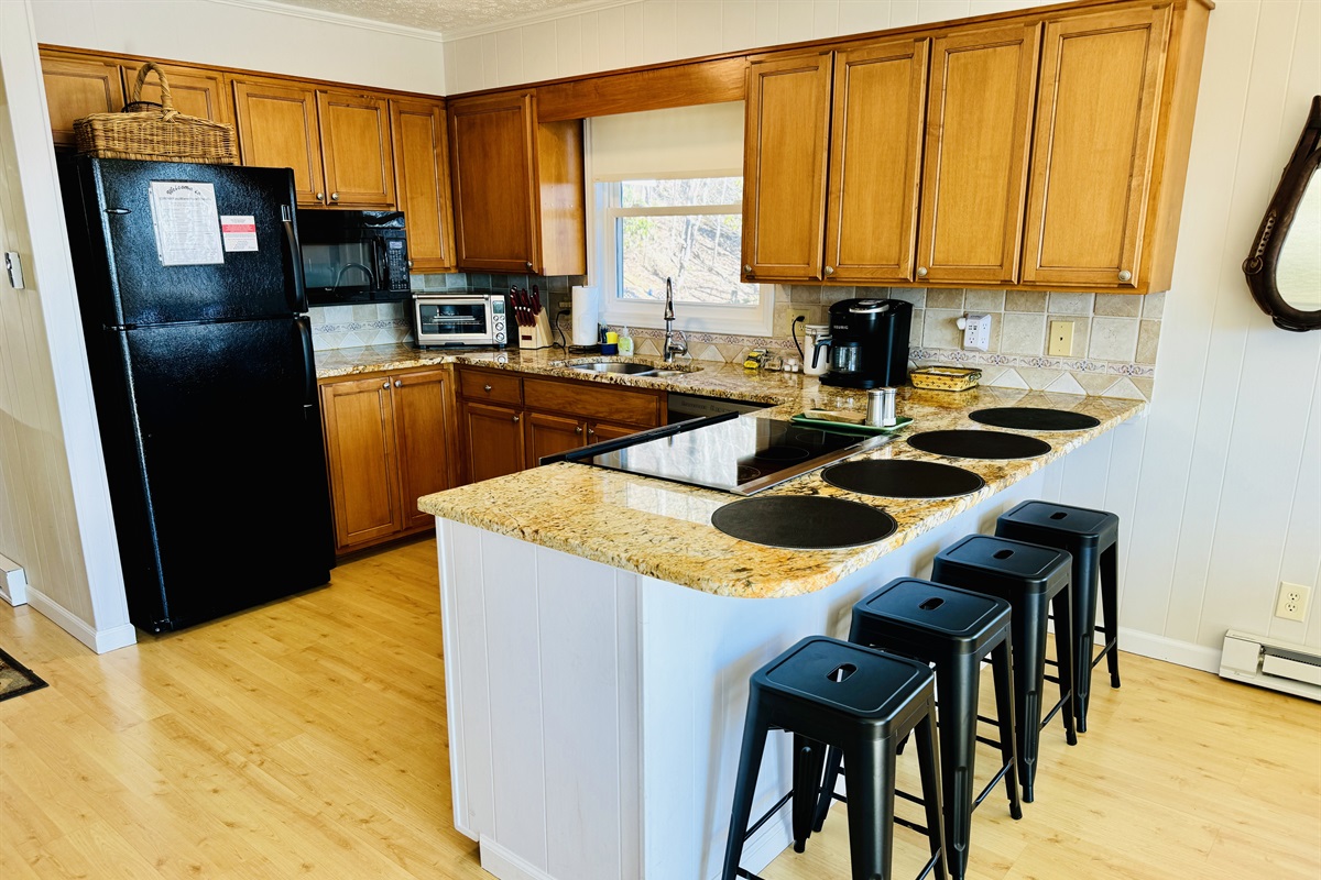 Our chef's kitchen is stocked & we cooked Thanksgiving for 10! Enjoy views, double ovens, smooth cooktop, pantry, dishwasher, double sink, fridge, microwave, lots of bakeware & serving dishes!