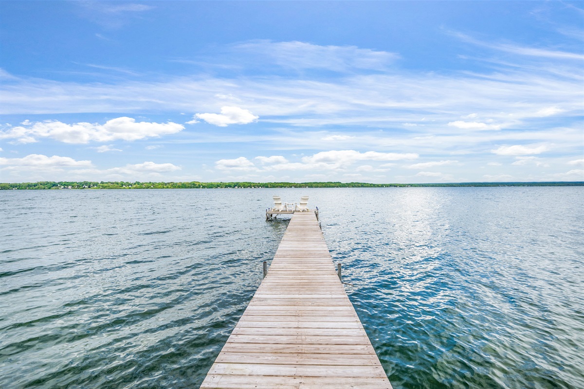 Private dock extending into serene waters—ideal for swimming, boating, or soaking up the view.