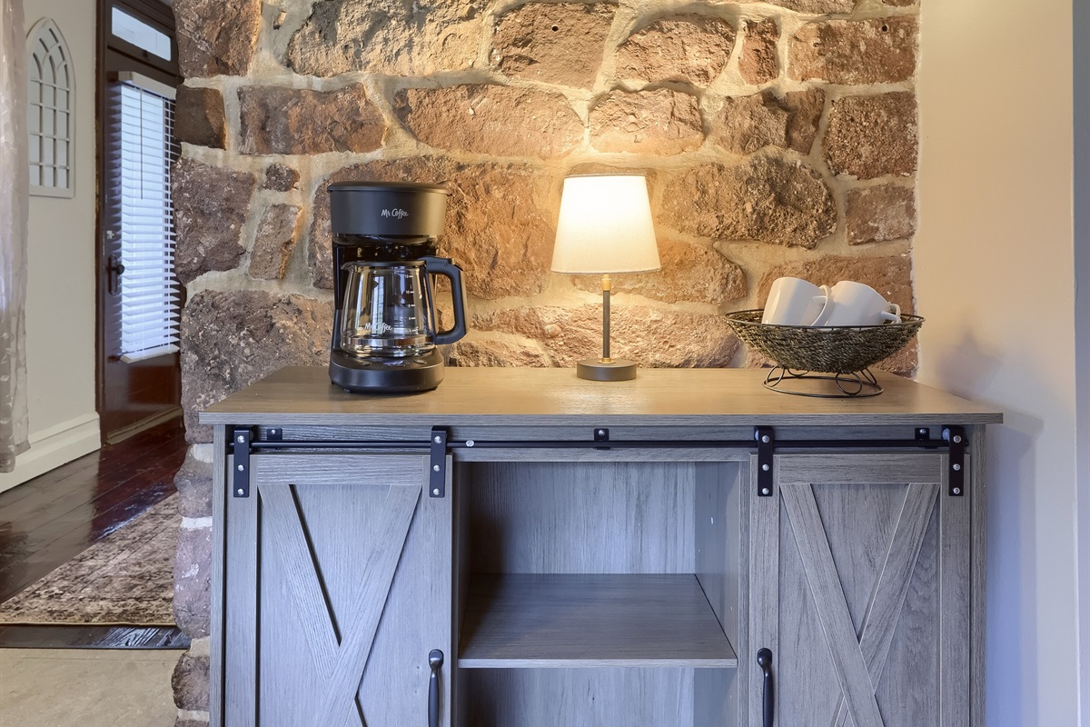 Coffee Pot with coffee grounds stocked.