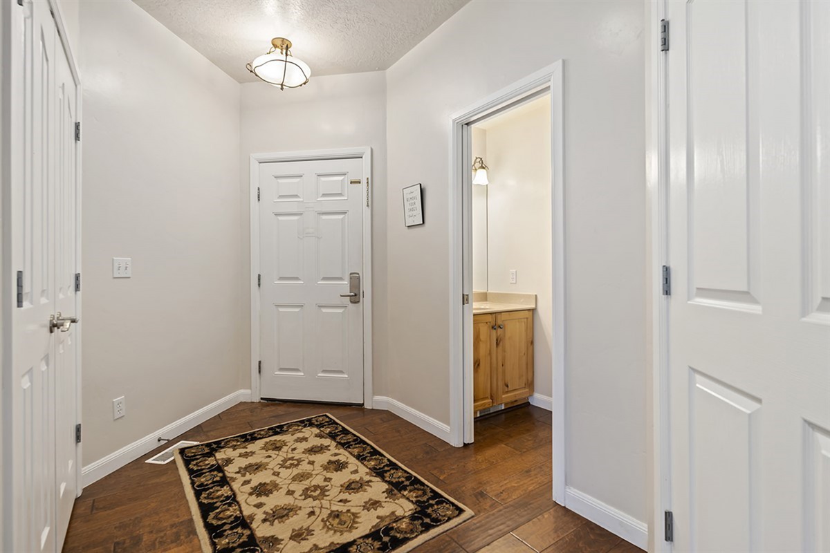 A clean and inviting entryway that sets the tone for your stay, offering seamless access to the main living spaces with a warm, welcoming feel.