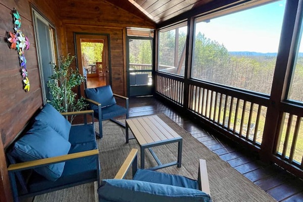 Mountain views from the wrap-around porch, especially the screened in porch in the back with comfy cozy outdoor furniture. 