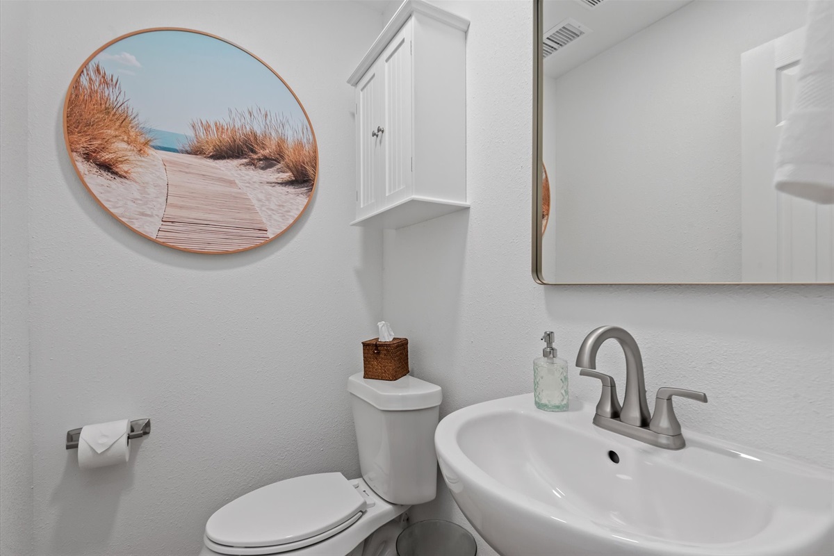 The bathroom offers easy access and convenience, designed for both comfort and practicality.