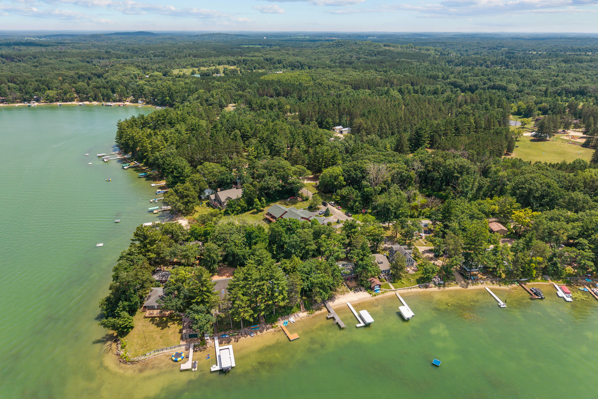 The serene beauty of the lake is even more breathtaking from above, offering a glimpse of the peaceful escape waiting for you.