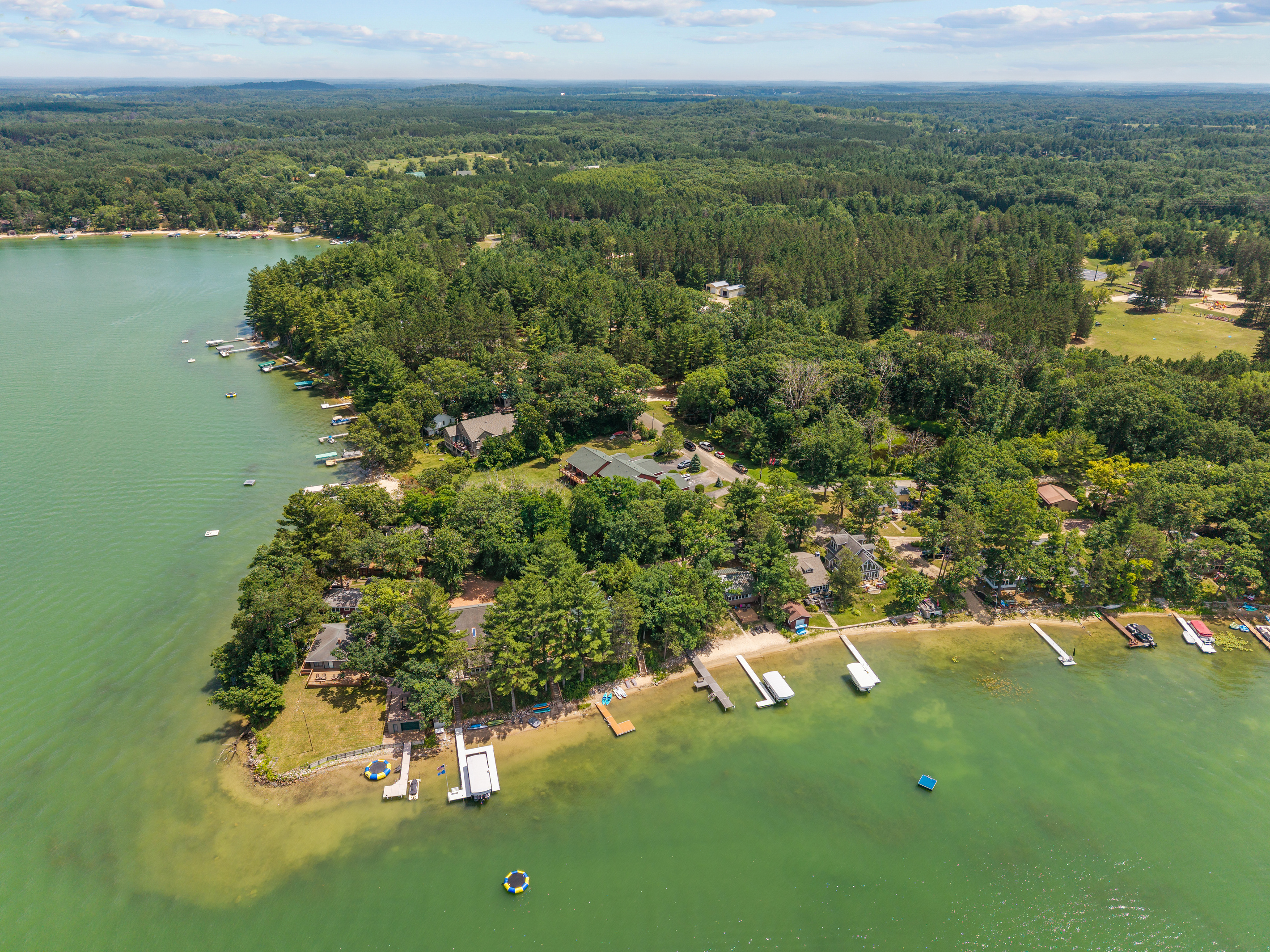 The serene beauty of the lake is even more breathtaking from above, offering a glimpse of the peaceful escape waiting for you.