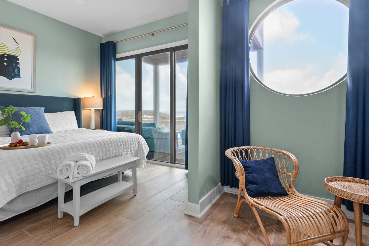 Wake up to stunning gulf views from this inviting bedroom, featuring an ensuite bathroom and private deck access.