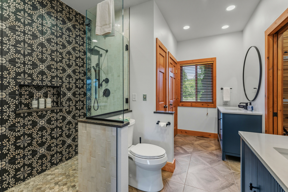 Elegantly designed and executed tile master ensuite shower with Kohler Showerhead and Hydro-Rail hand shower.