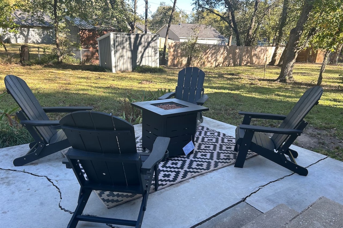 Relax under the stars on the patio with a propane fire pit and seating for four.