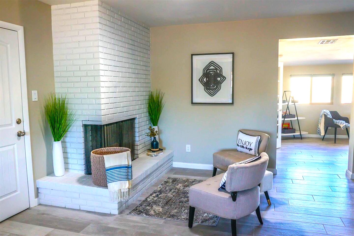 Additional seating by the fireplace in the dining and kitchen area.