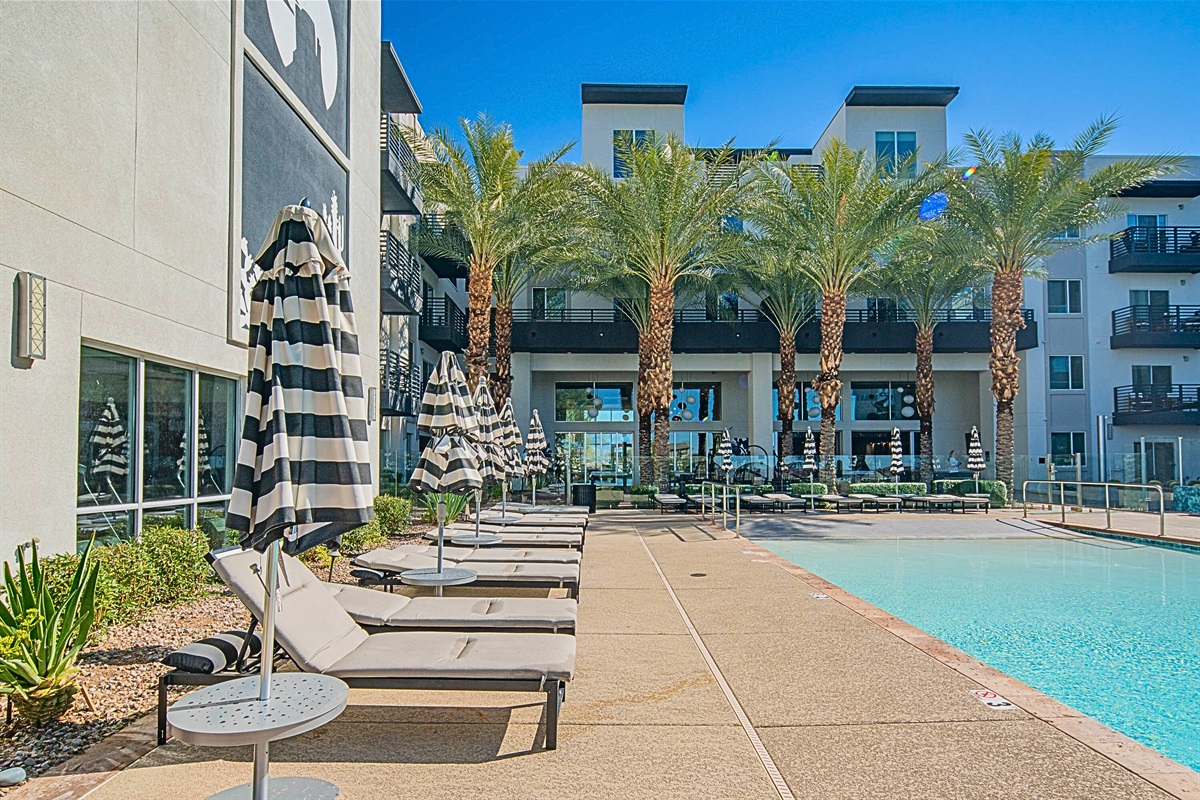 Soak up the sun! Relax on stylish loungers by the sparkling pool.