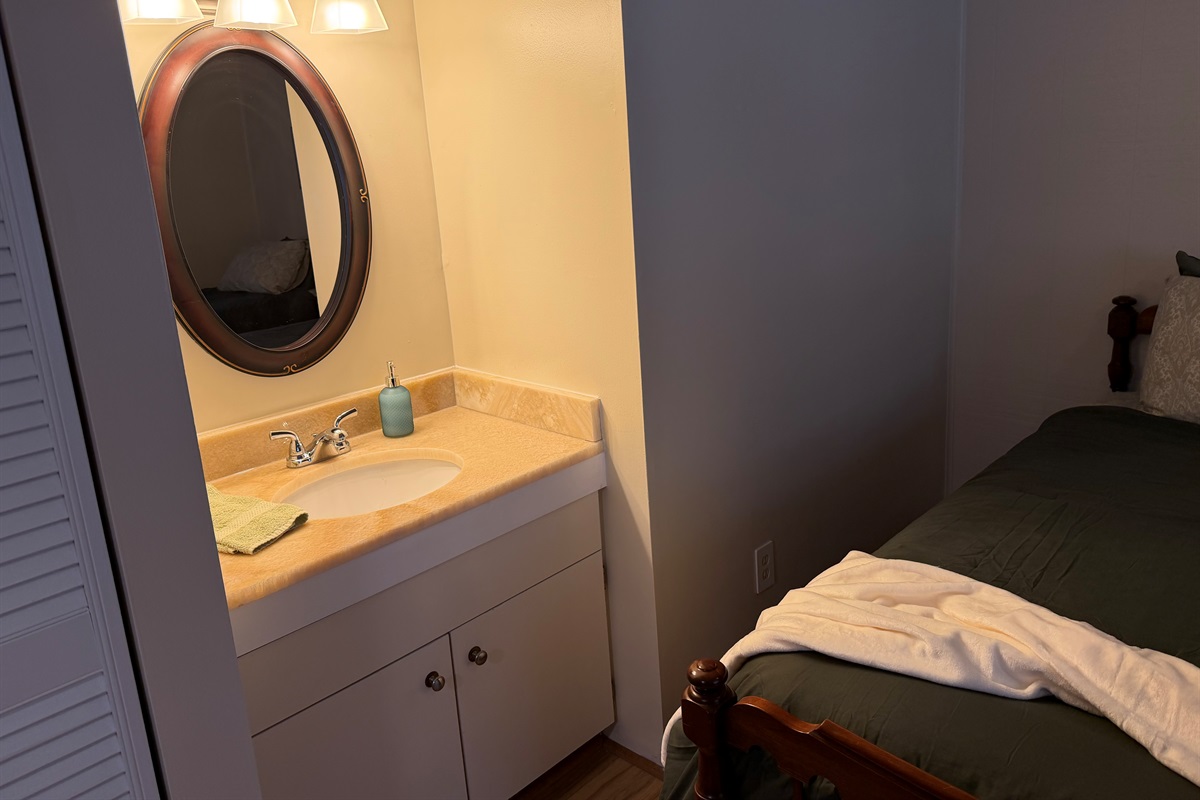 Twin bedroom with personal sink