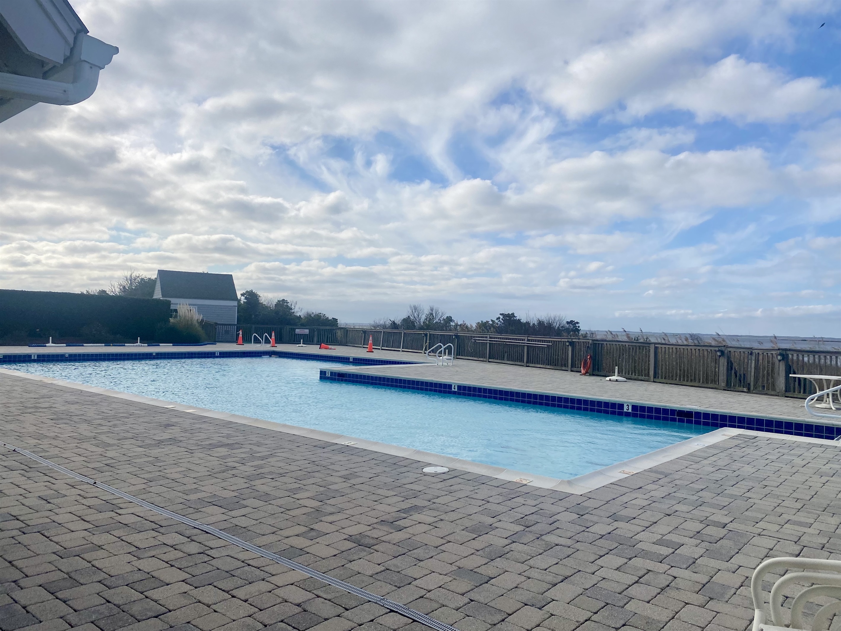 The community pool is free to use and located 1 mile north at the Sanderling Community Center. You can drive and park or ride a bike. Enjoy views of the Sound from the pool. Pickleball and tennis courts available too!