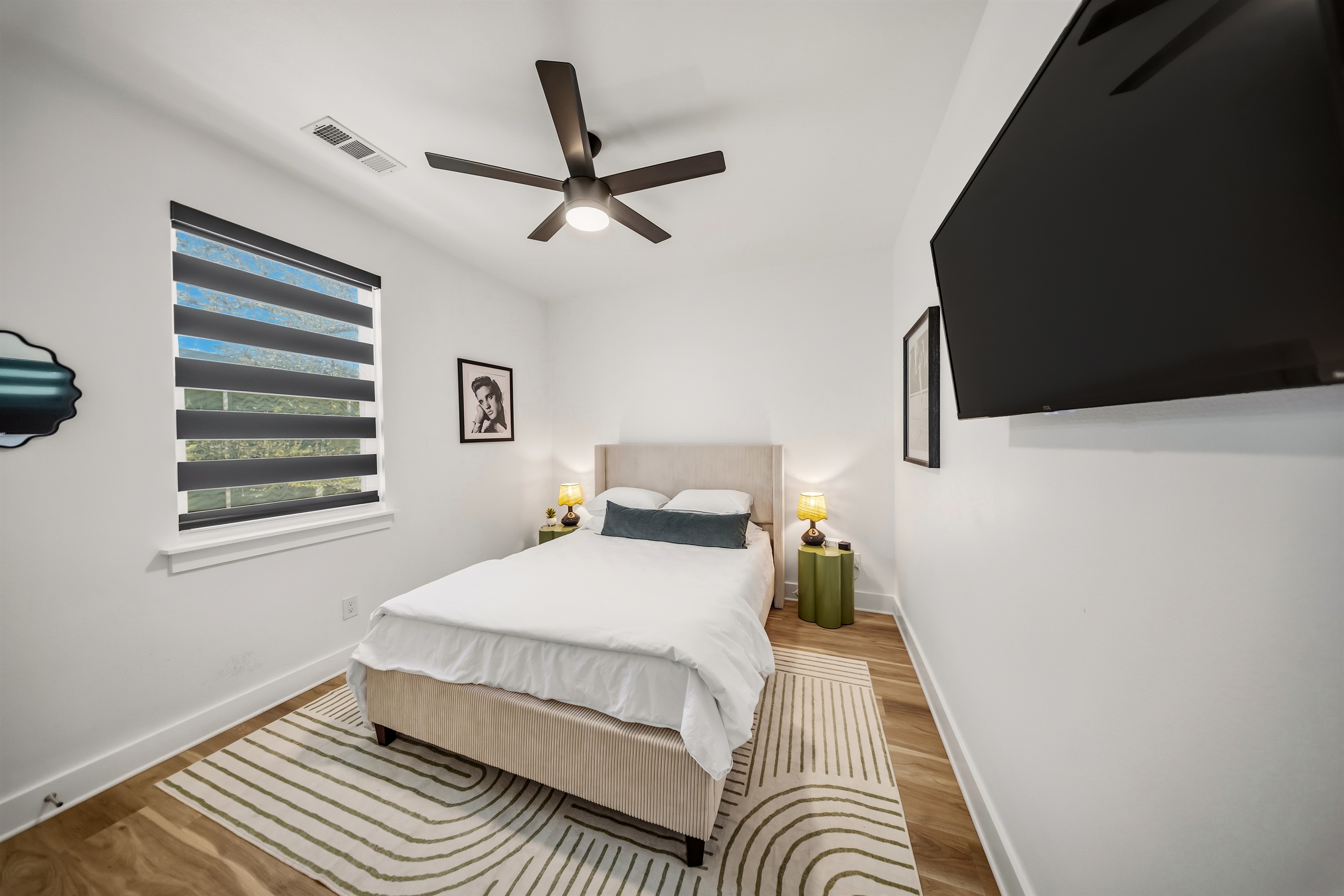 This bedroom features a queen-sized bed with crisp cotton linens for ultimate comfort. The twin/Full Rollaway bed fits a full-size adult or two young kids. A smart TV is available for your entertainment.