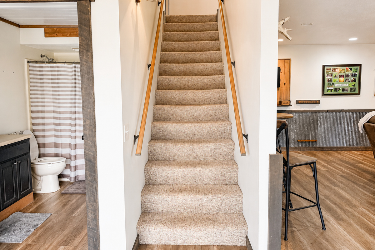 Interior staircase connects the lodge living and sleeping spaces, helping larger groups easily spread out throughout the property while still staying together under one roof.