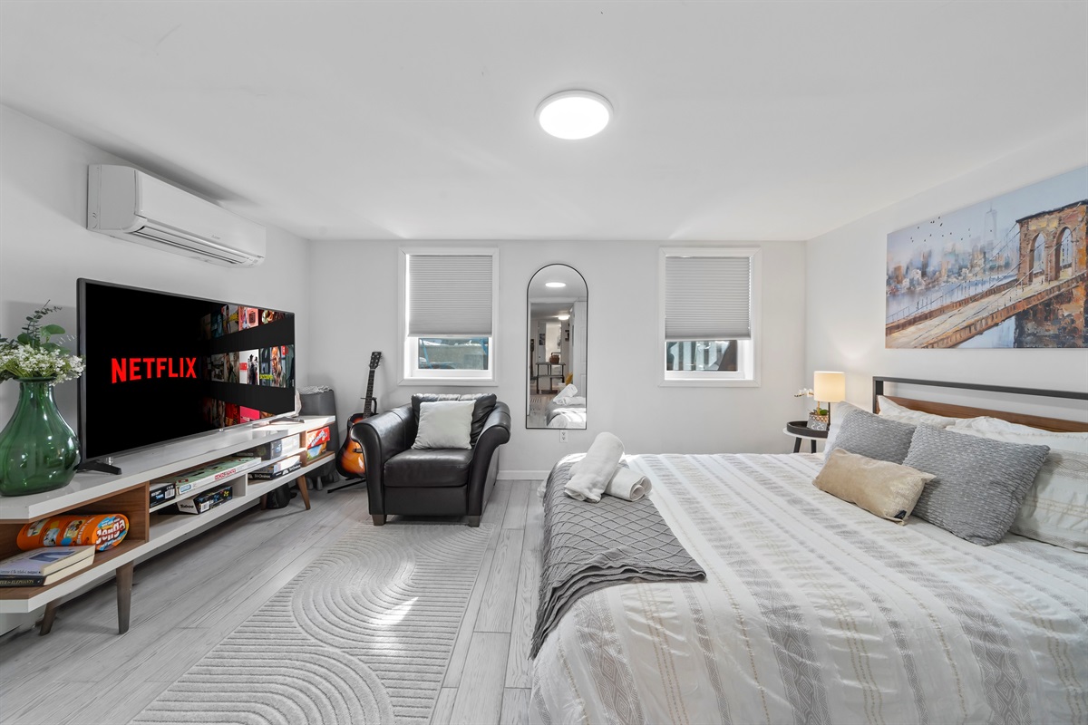 Wake up slowly in a bright, peaceful bedroom that makes restful sleep feel effortless after full days in the city.