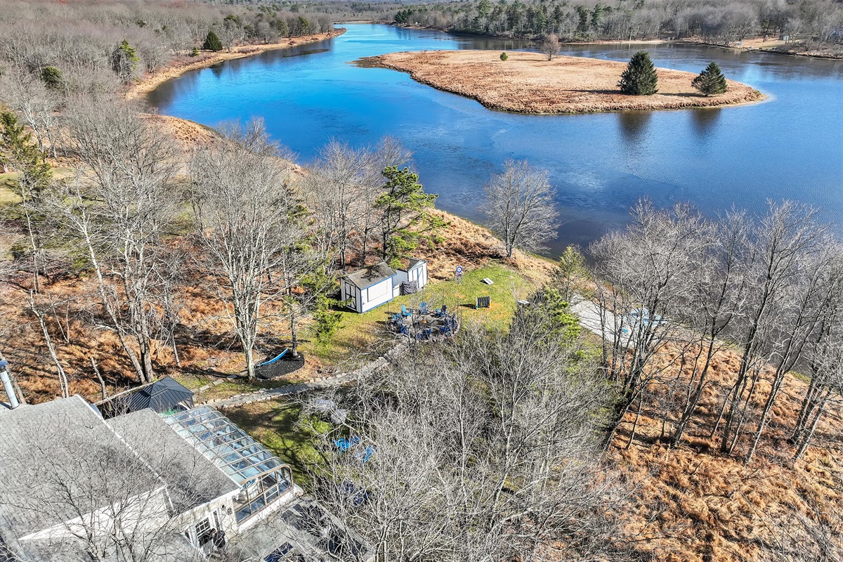 Bird’s-eye serenity over water and woods