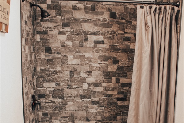 The Upper Level Full Bathroom is a tub and shower combination