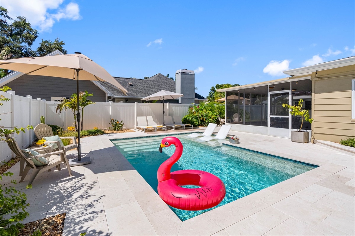 Soak in the sun poolside or float away on a flamingo in this serene, resort-style retreat.