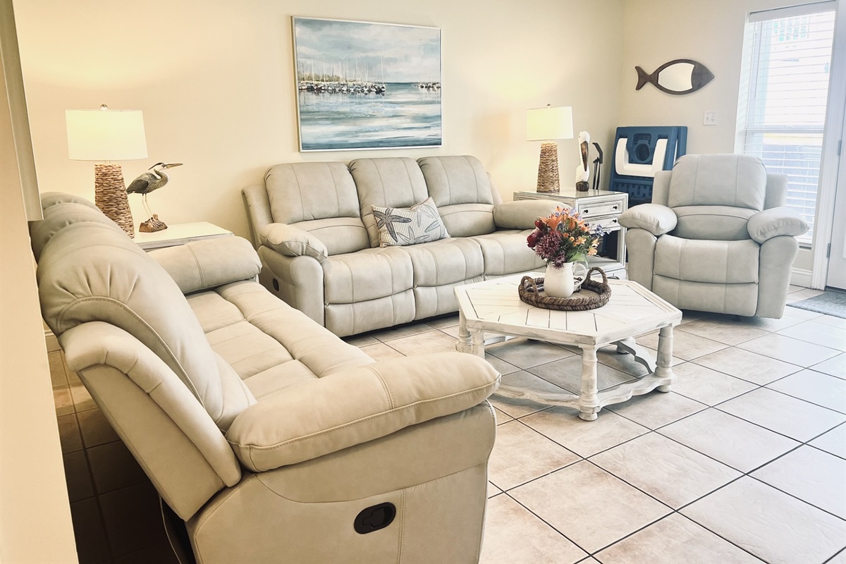 New Living Room furniture with 2 leather sofa's that both have 2 built in recliners. Plus, large recliner!