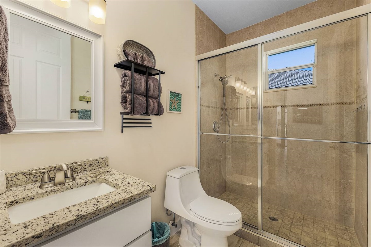 2nd Guest bathroom featuring a shower. 