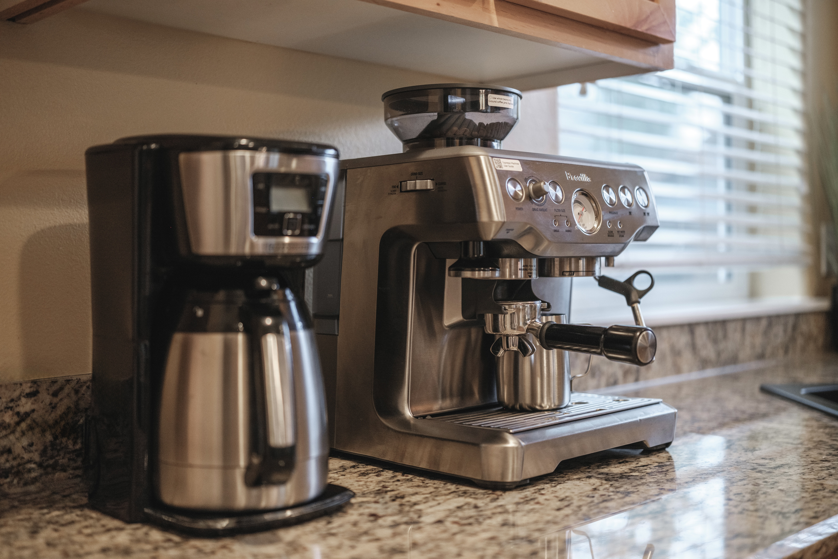 Slow mornings start here. Enjoy espresso or fresh coffee with our Breville espresso maker.