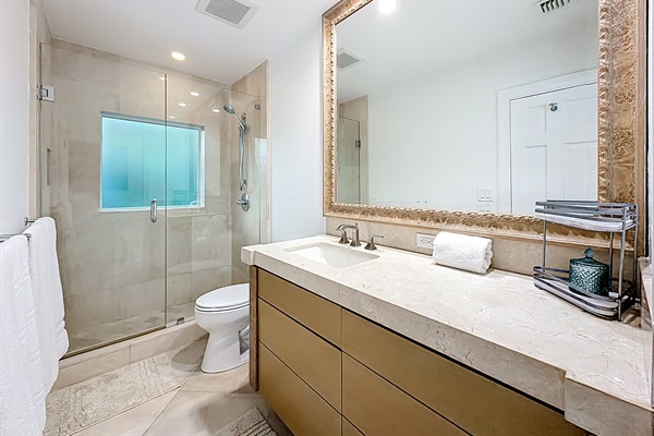 Nice marble bathroom between bedroom 2 and bedroom 3. 