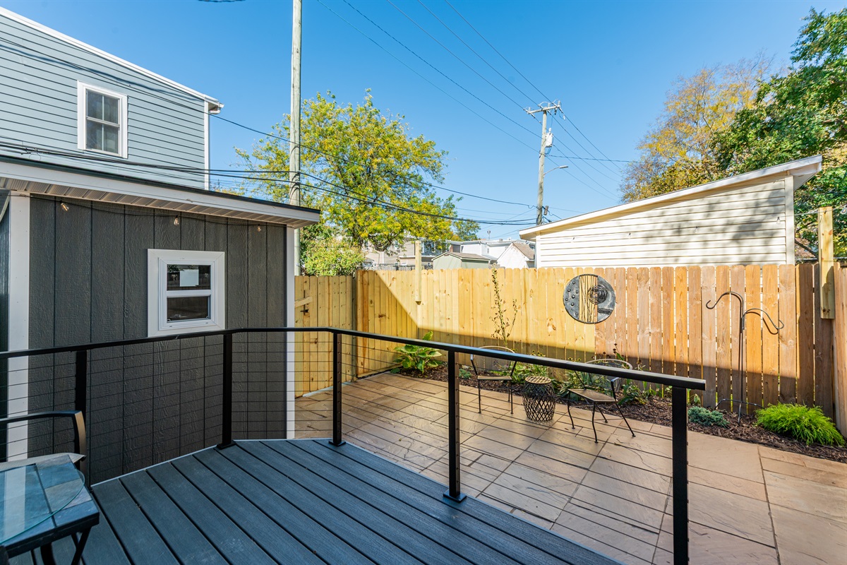 Private Patio Retreat: Enjoy sunny days on your spacious outdoor deck with lovely garden views!