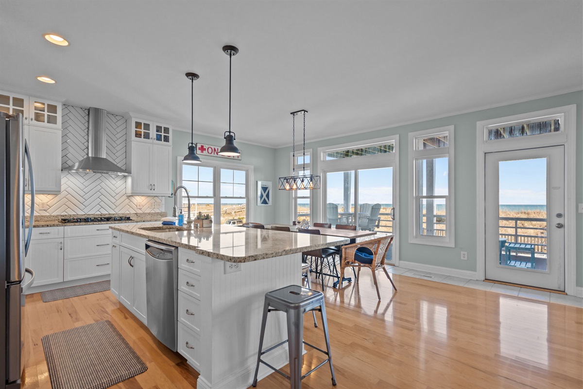 1st floor gourmet kitchen seats 14 (8 at table, 6 at island)