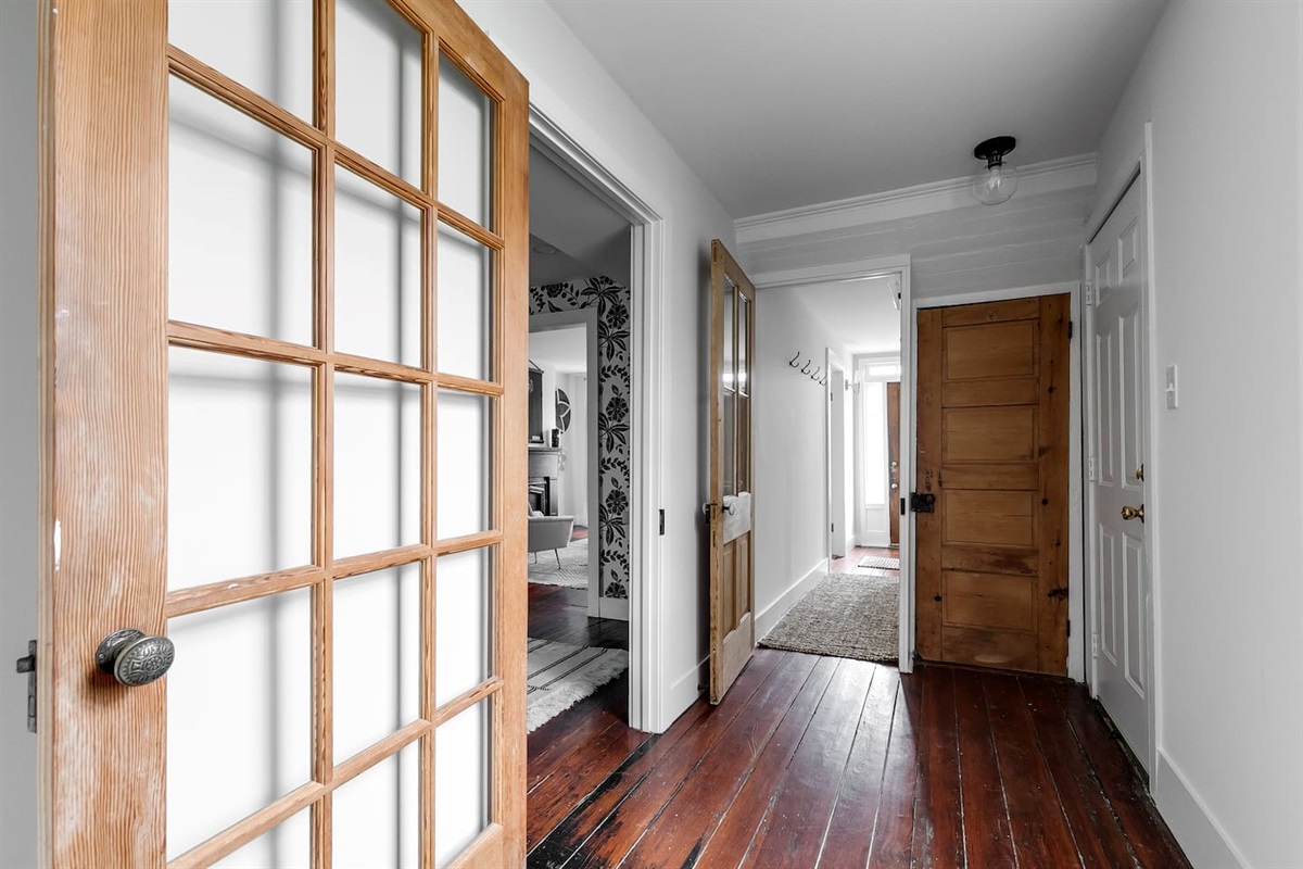 Side Entryway: Step into elegance with natural light and charming hardwood floors inviting you home!