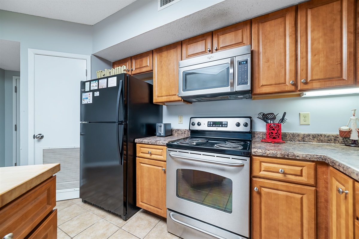 Modern kitchen essentials at your fingertips. This countertop setup offers everything you need for a quick breakfast or a relaxing cup of coffee.