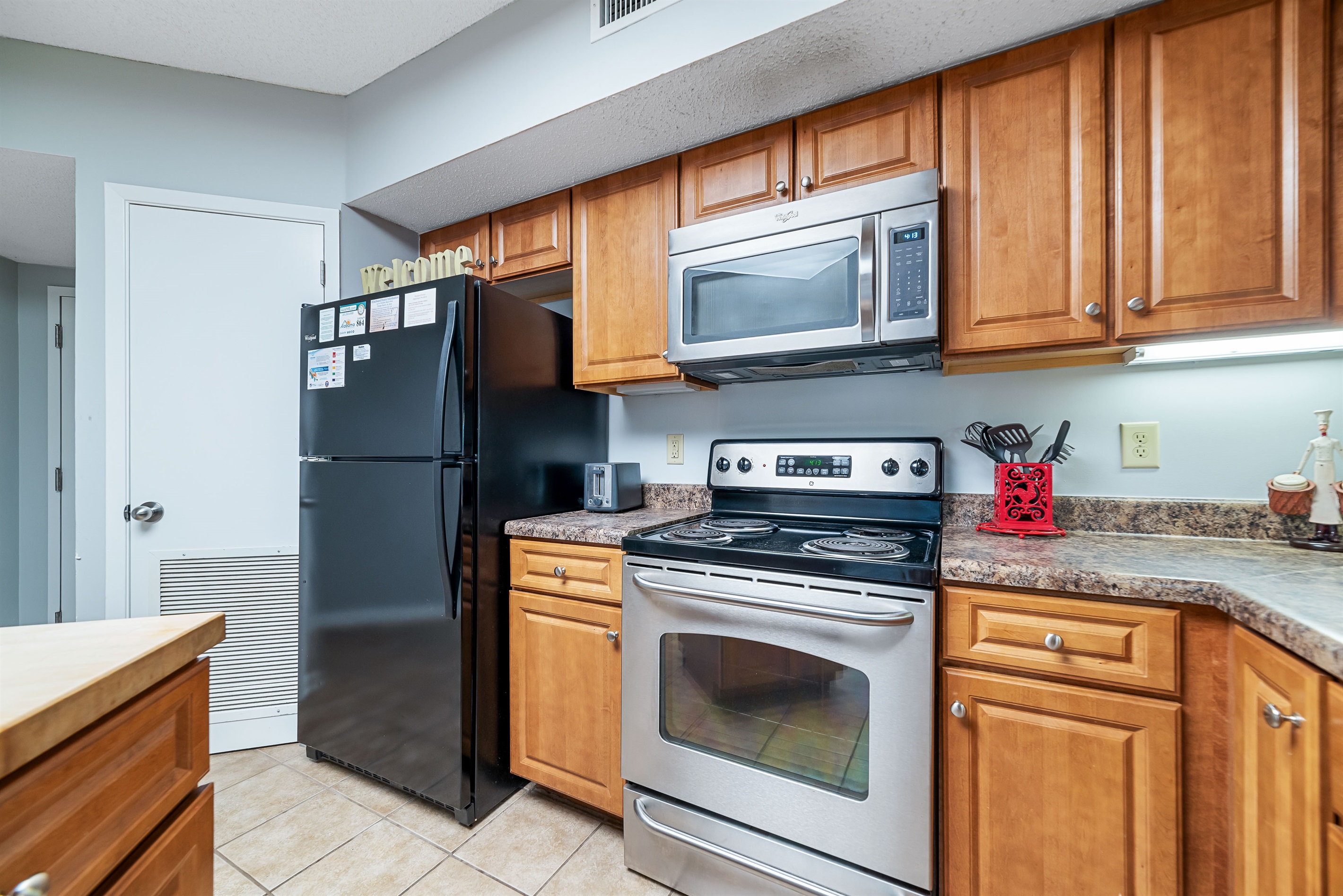 Modern kitchen essentials at your fingertips. This countertop setup offers everything you need for a quick breakfast or a relaxing cup of coffee.