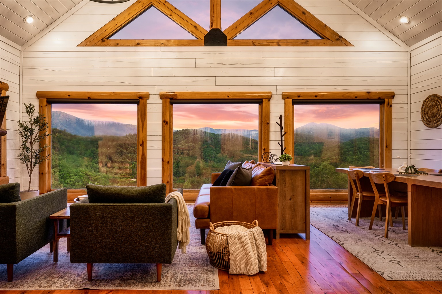 Cozy up in our inviting living room with a view that feels like home sweet home. Let the warmth of our space embrace you as you unwind and soak in the beauty of nature just outside your window