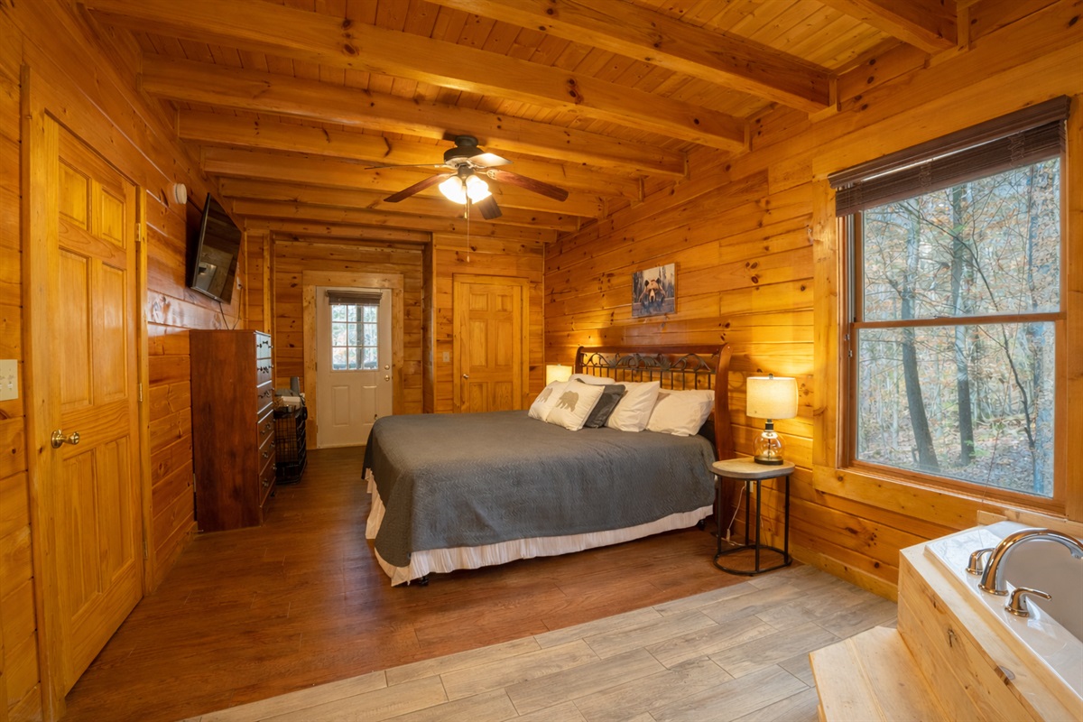 With private access to the back deck and space for your fur baby, you'll find this master bedroom private and spacious!