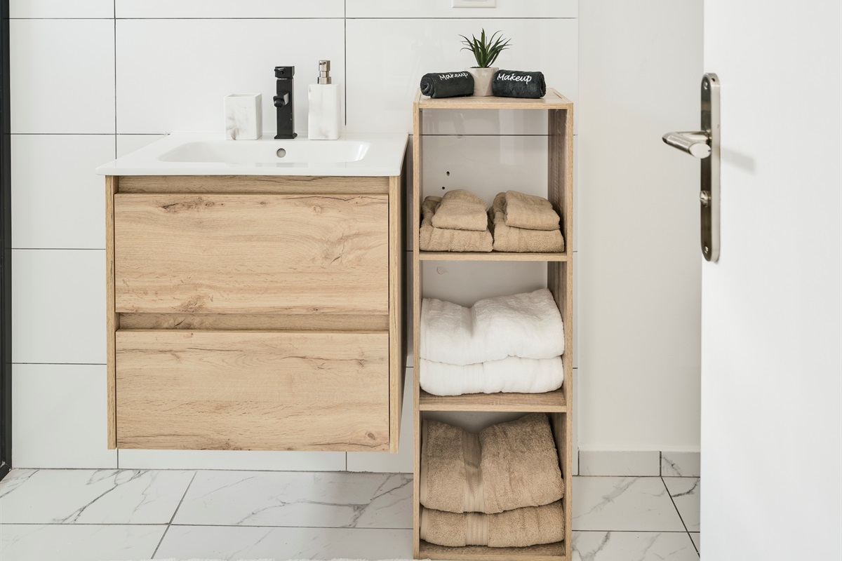 Stylish Bathroom Storage with Natural Wood Shelves & Decor Accents