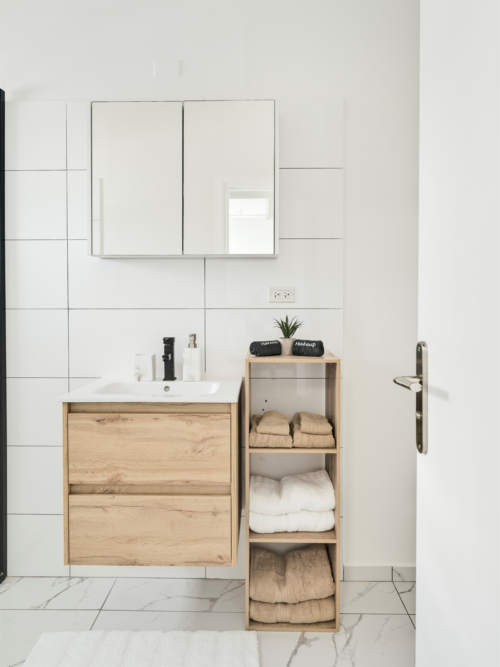 Stylish Bathroom Storage with Natural Wood Shelves & Decor Accents